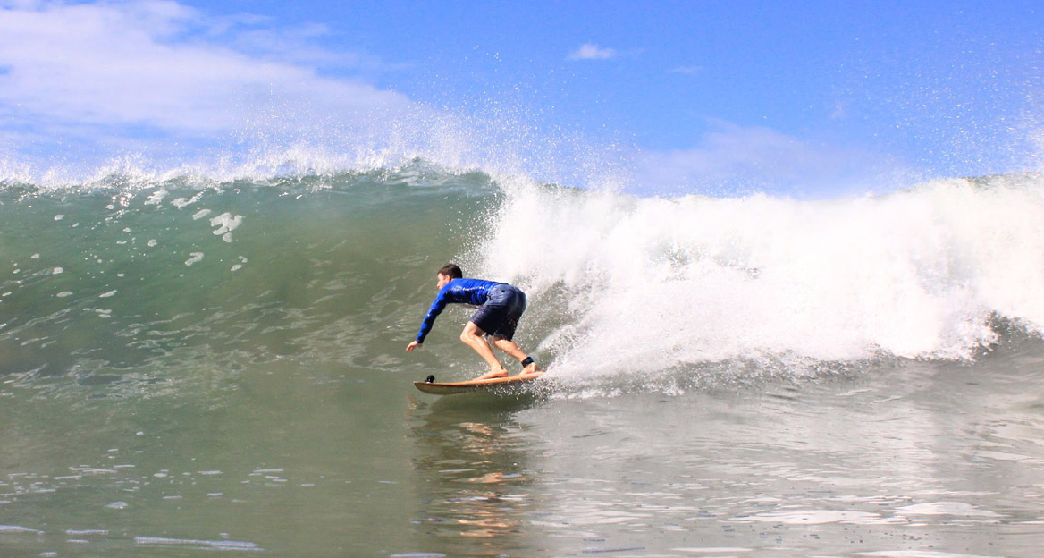 Taylor catching a wave at SantaTeresa in Costa Rica, 2018. (Photo by @waves_art_photography, Instagram )